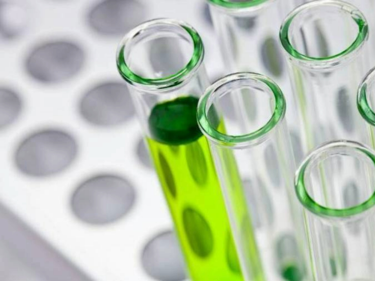 Glass vile with green liquid